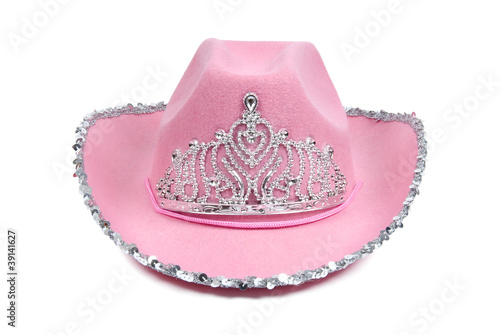 Pink cowboy hat with tiara on white background.