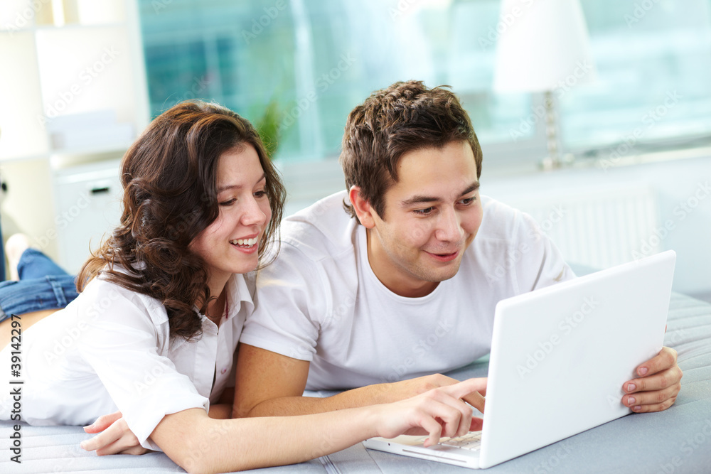 Couple using laptop Couple using laptop