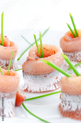 Rolls of marinated herring photo