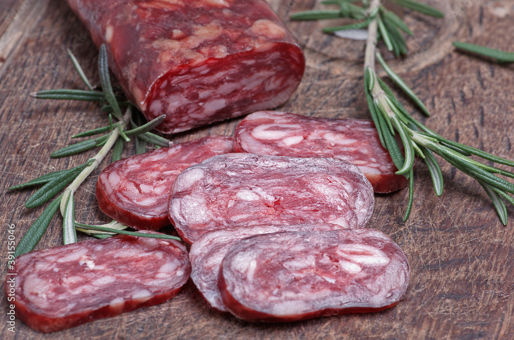salami on wooden background salami on wooden background