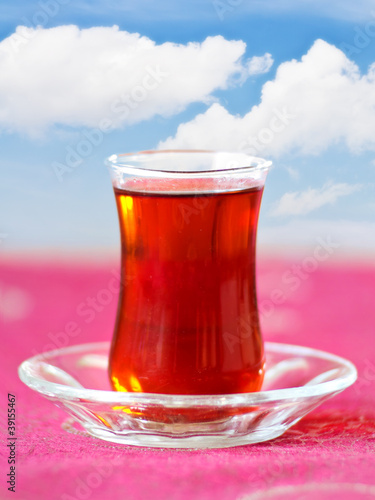Glass of Turkish Tea on red tablecloth