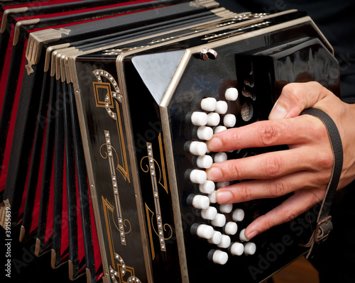 Playing traditional bandoneon.