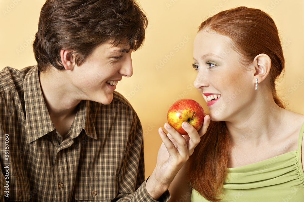 Young couple with an apple Young couple with an apple