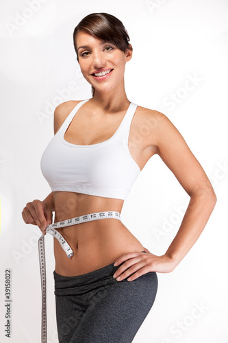 Sexy girl happy with waist measuring and abs