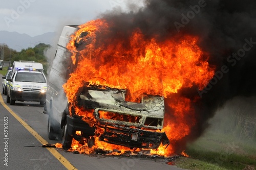 Burning Delivery Vehicle and Police Cars