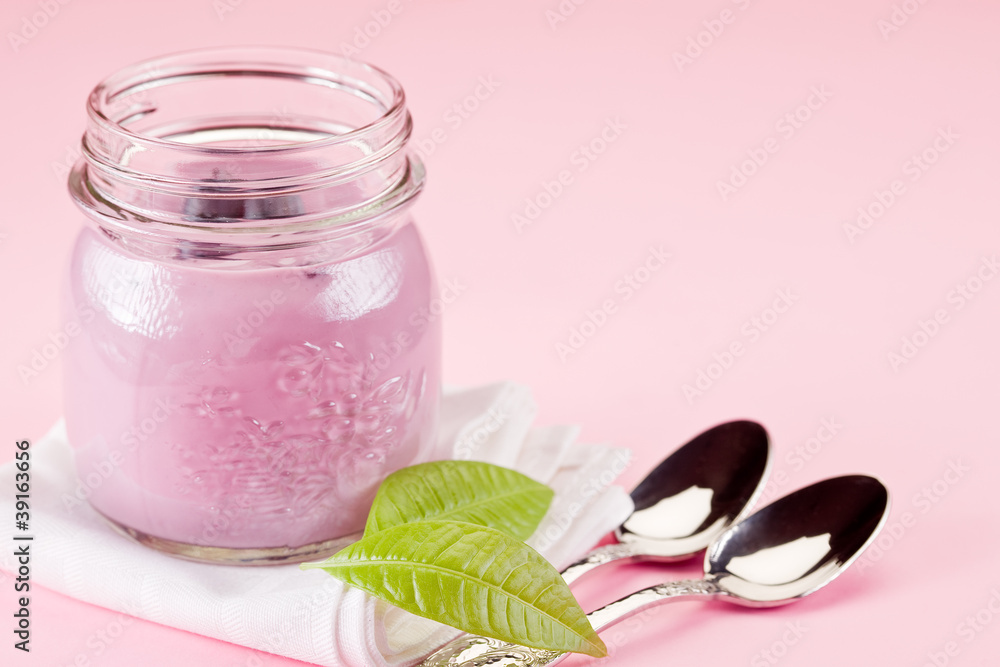 Yogurt on rose background Yogurt on rose background