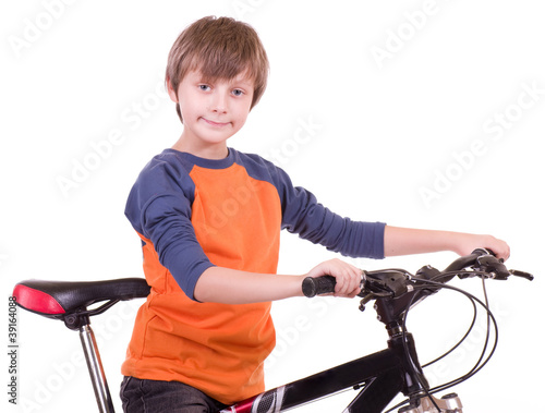Little beautiful boy with bycicle on white background