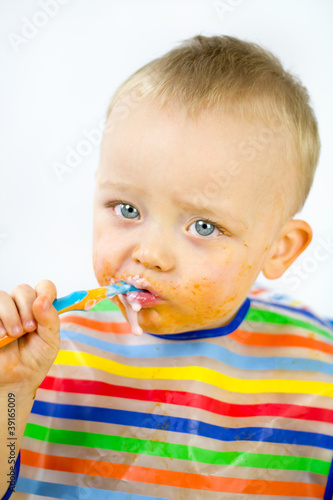 Infant Eating with food round his Face