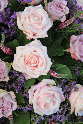 Big pink roses in a floral arrangement