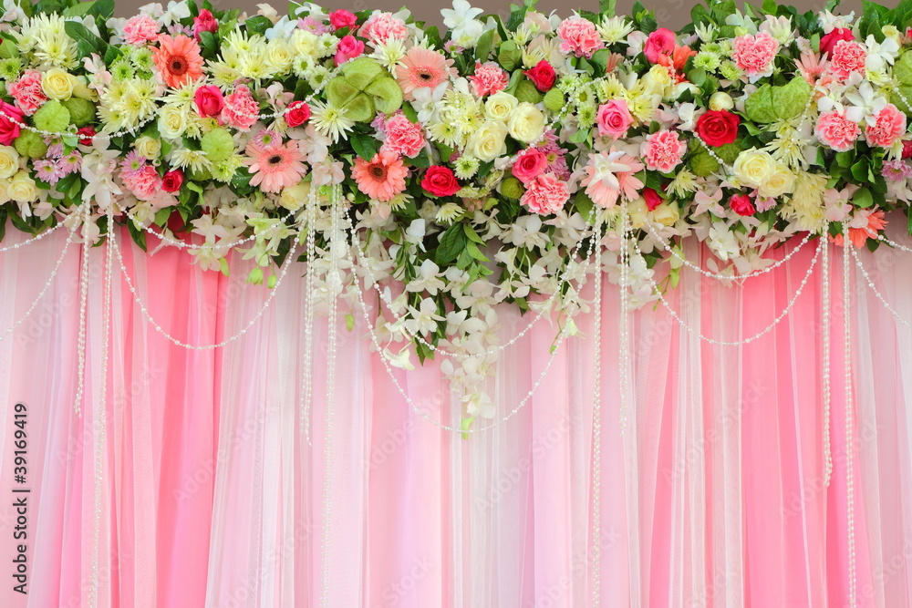 Beautiful exotic flowers arrangement over pink and white fabric Beautiful exotic flowers arrangement over pink and white fabric