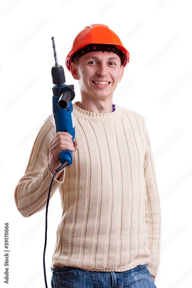 Workman in red helmet with drill Workman in red helmet with drill