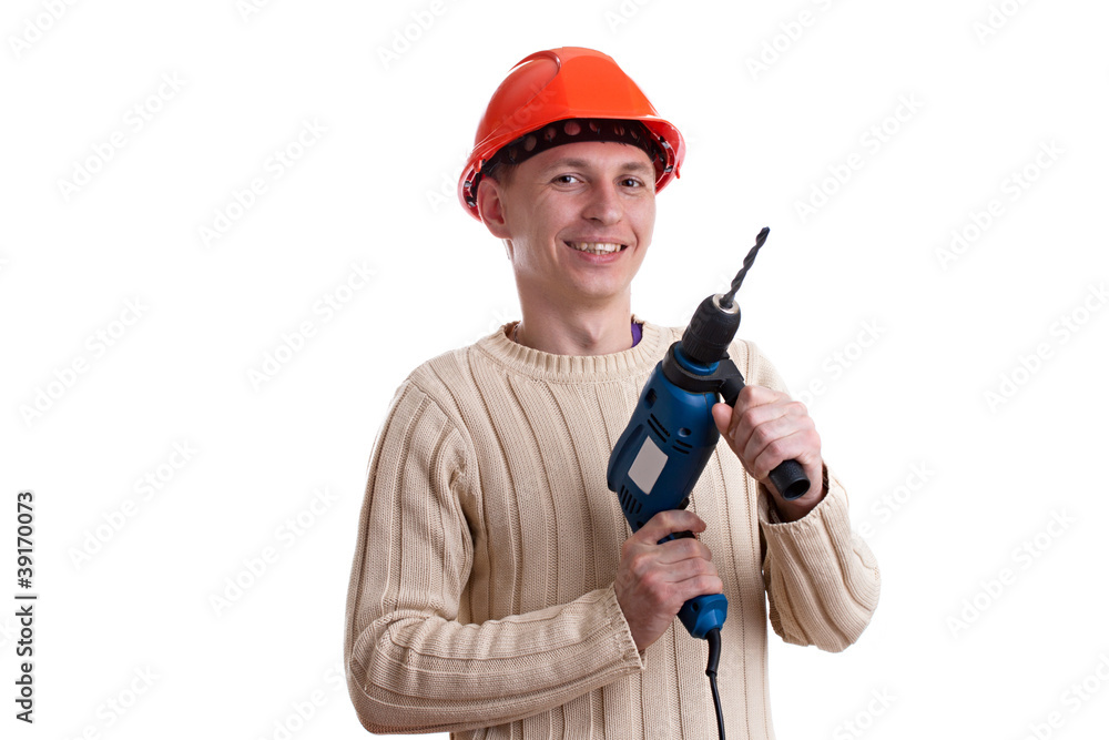 Workman in red helmet with drill Workman in red helmet with drill