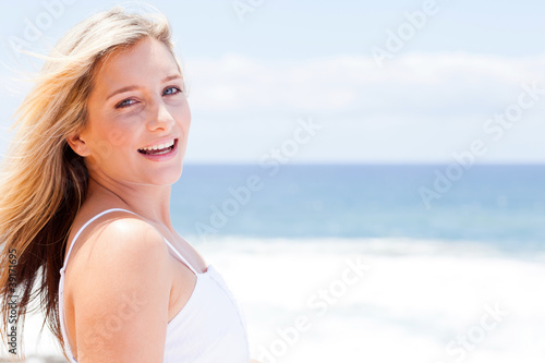 cheerful young woman smiling outdoors