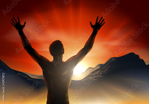 Man in silhouette arms raised on mountain