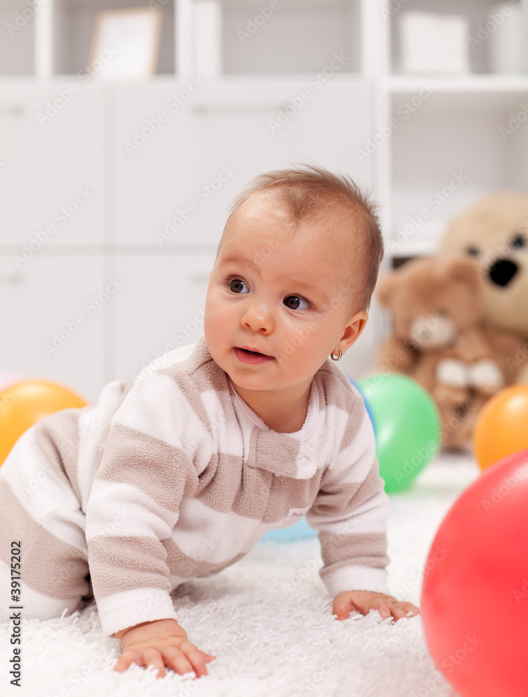 Baby girl with balloons