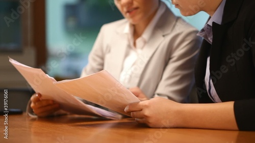 Attractive women working with documents in office