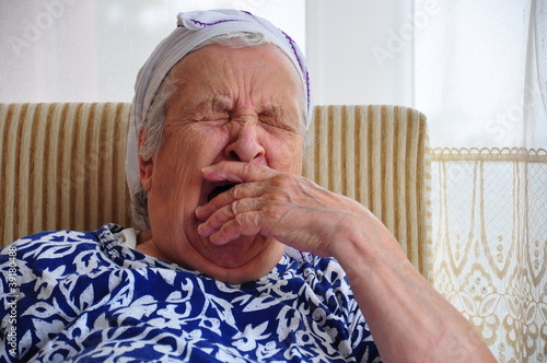 Obraz na plátně senior woman yawning