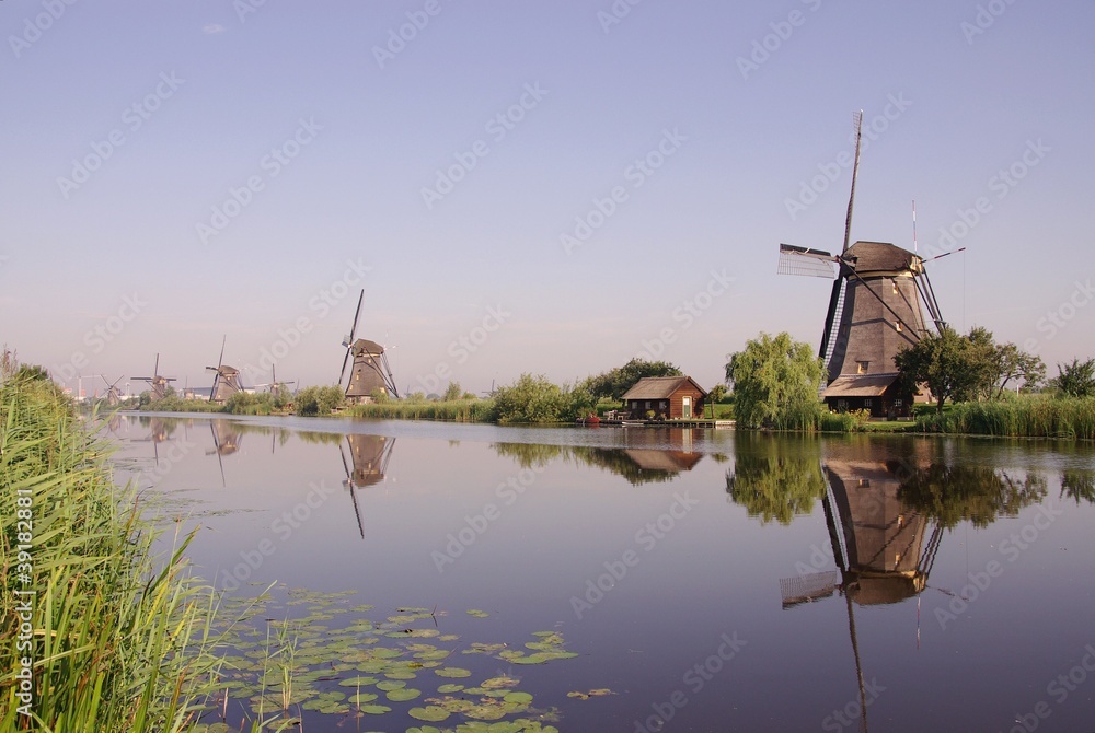 Wind mills along a canal in Kinderdijk in the Netherlands