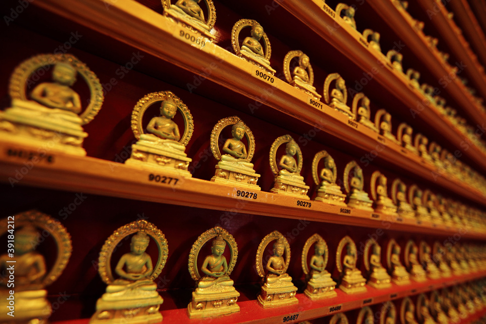 Fototapeta premium rows of golden buddha statue