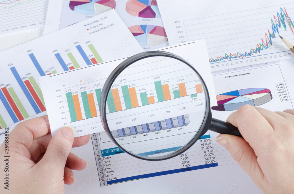 Graphs, charts, business table. The workplace of business people Graphs, charts, business table. The workplace of business people