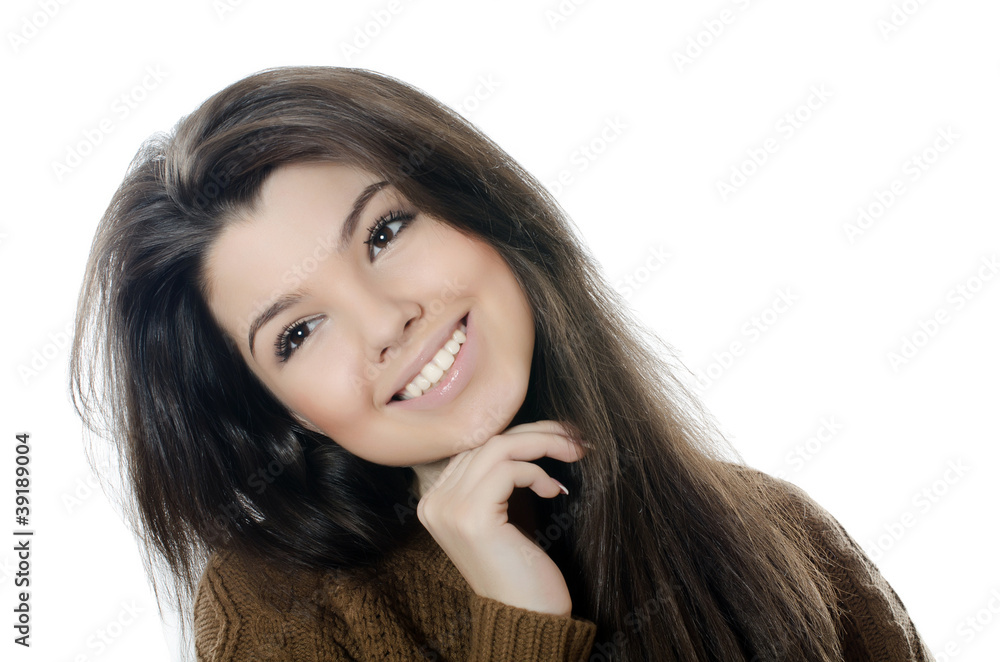 The beautiful girl in a brown sweater isolated The beautiful girl in a brown sweater isolated