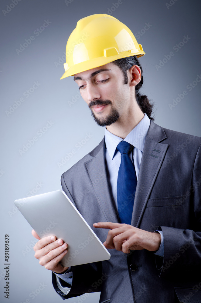 Construction worker working on tablet Construction worker working on tablet