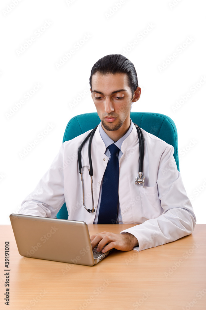 Male doctor working on laptop Male doctor working on laptop