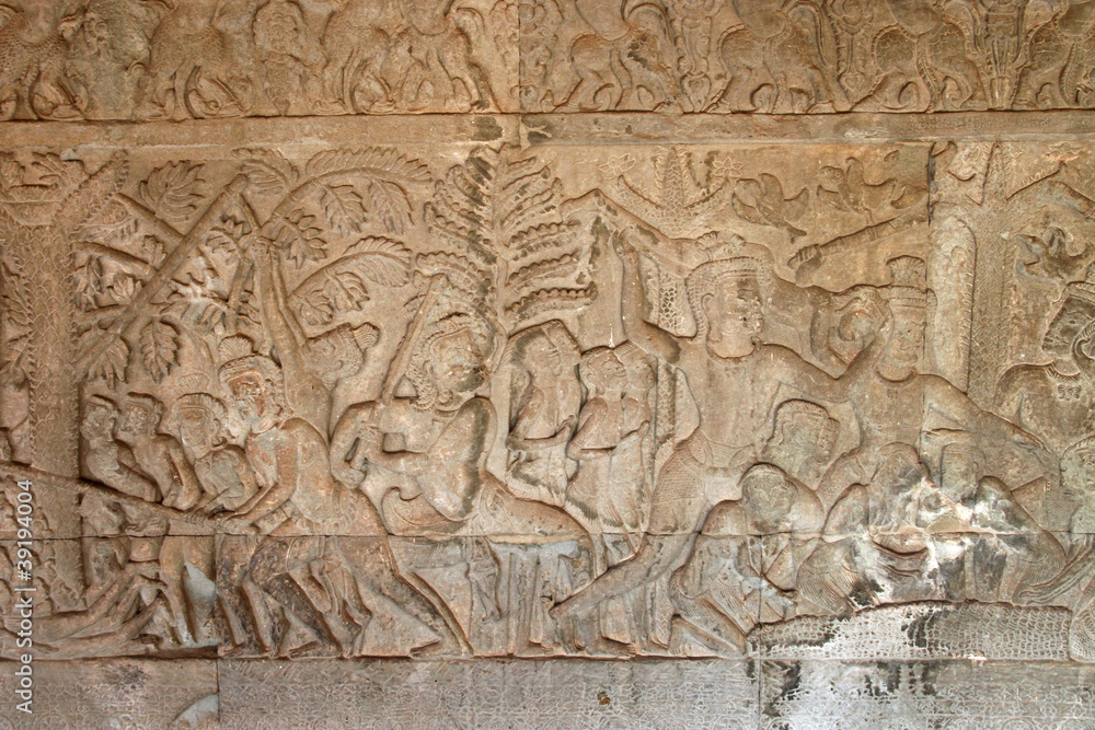 Fototapeta premium Carvings on wall and terrace of Angkor Wat