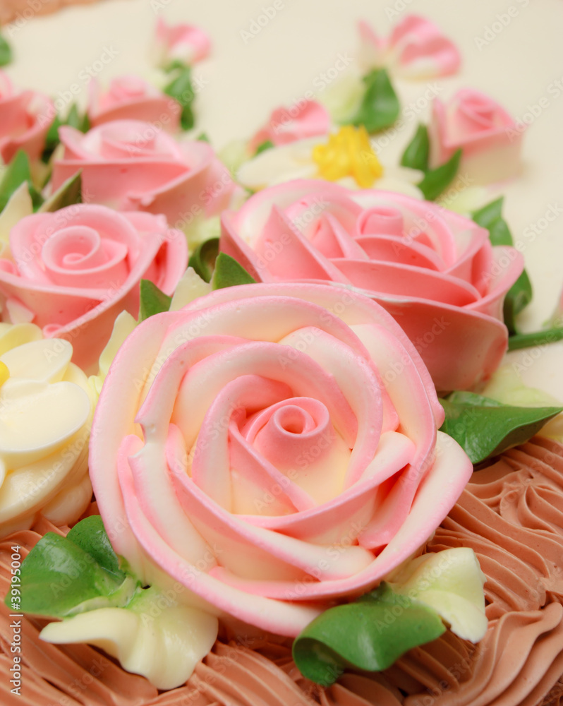 Flower cream on top of beatiful cake Flower cream on top of beatiful cake
