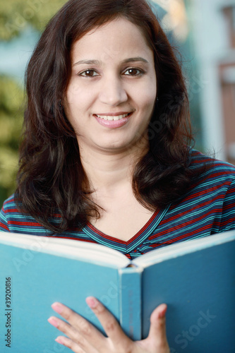 Cheerful indian female college student