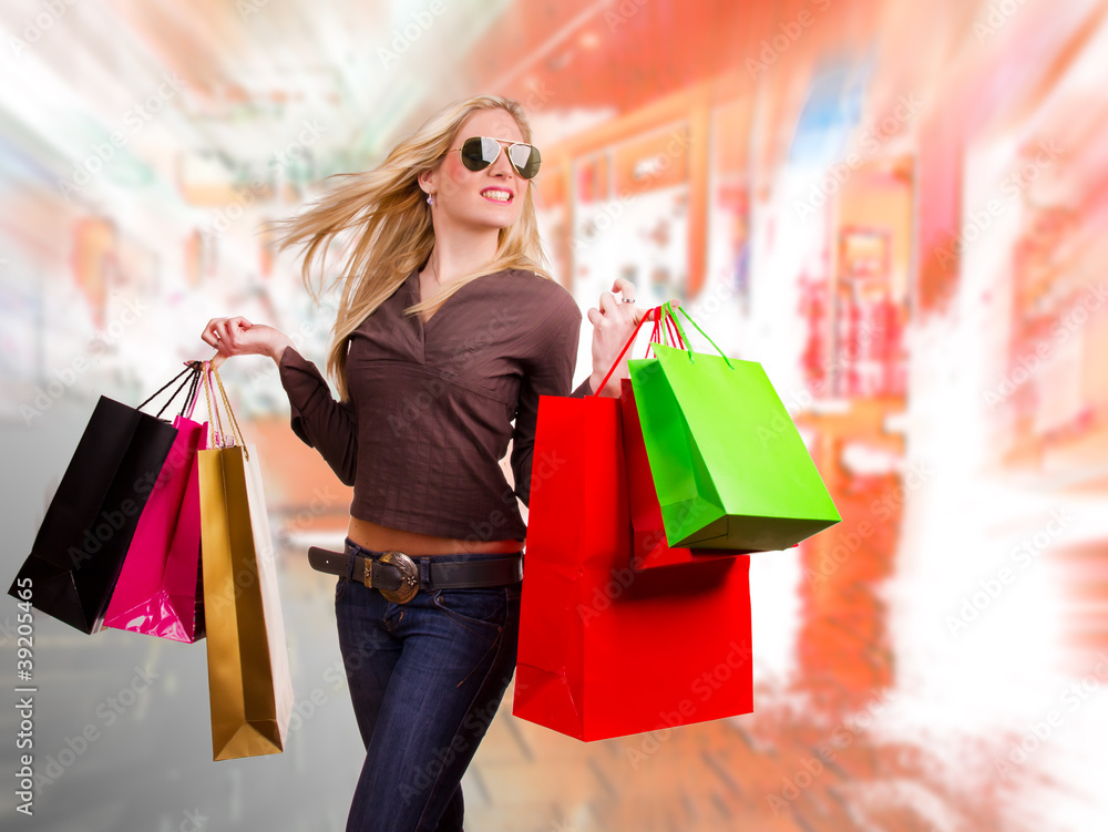 Beautiful girl with shopping bags wearing sunglasses Beautiful girl with shopping bags wearing sunglasses