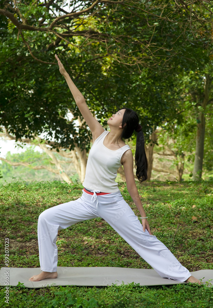 yoga woman on green grass