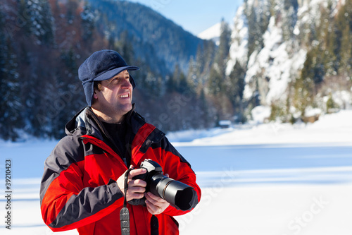 Professional photographer in the winter landscape