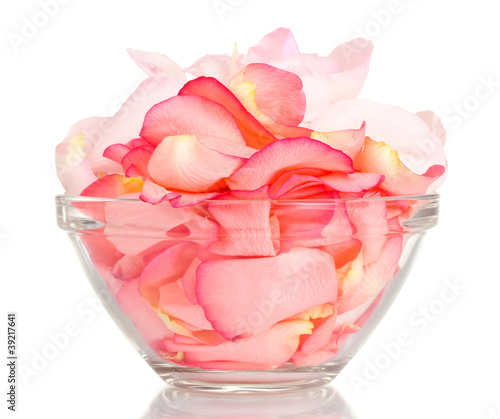 beautiful pink rose petals in glass bowl isolated on white