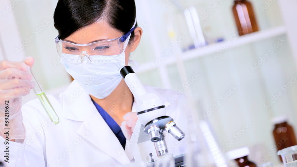 Asian Chinese Female Using Laboratory Equipment Asian Chinese Female Using Laboratory Equipment