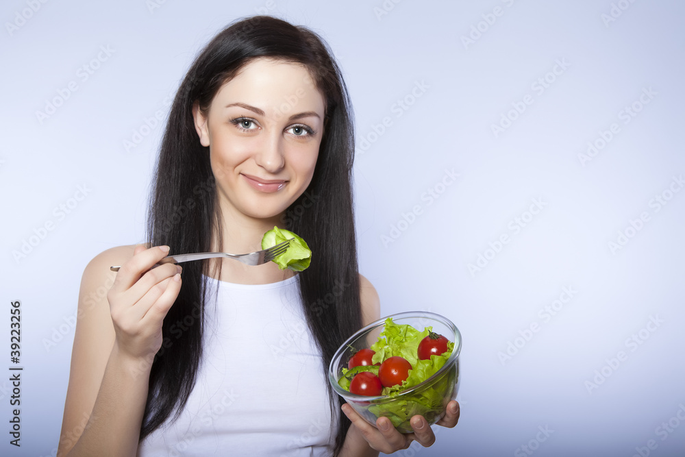 portrait of attractive smiling woman eating salat portrait of attractive smiling woman eating salat