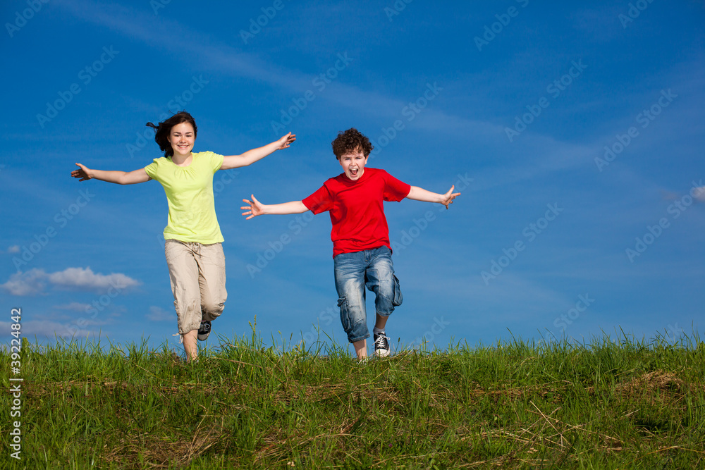 Girl and boy running, jumping outdoor Girl and boy running, jumping outdoor