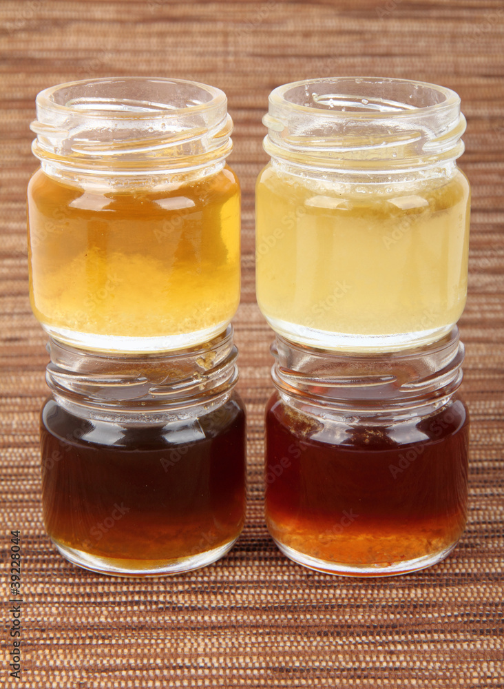 Four jars full of honey, mix taste Four jars full of honey, mix taste