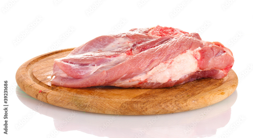 Raw meat on a wooden board isolated on white Raw meat on a wooden board isolated on white