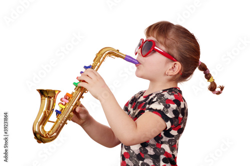 Canvas Print little girl with sunglasses play music on saxophone