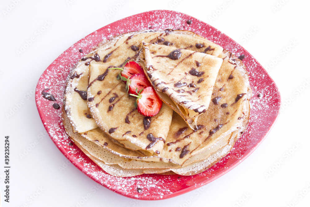 sweet pancakes with strawberries on red plate sweet pancakes with strawberries on red plate