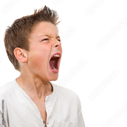 Close up portrait of boy shouting