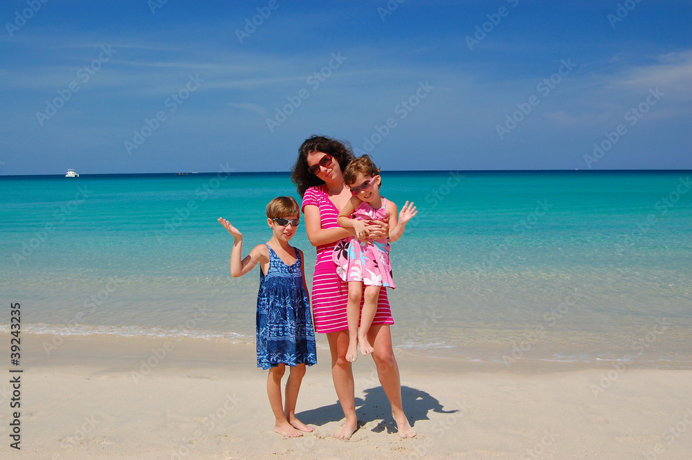 Family beach vacation. Happy mother with kids having fun Family beach vacation. Happy mother with kids having fun
