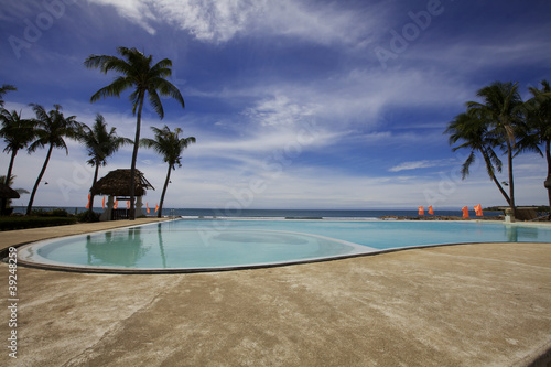 Fototapeta Naklejka Na Ścianę i Meble -  Infinity Pool at Tropical Resort