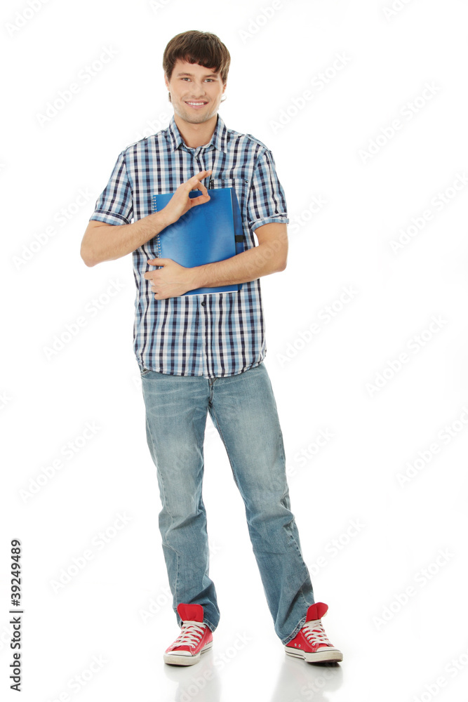 Naklejka premium Young student man with notebook