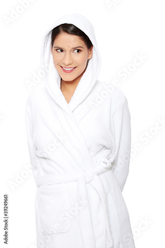 Young beautiful happy woman in bathrobe