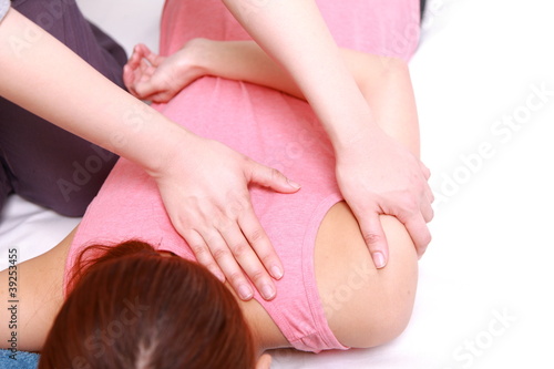 woman getting chiropractic photo