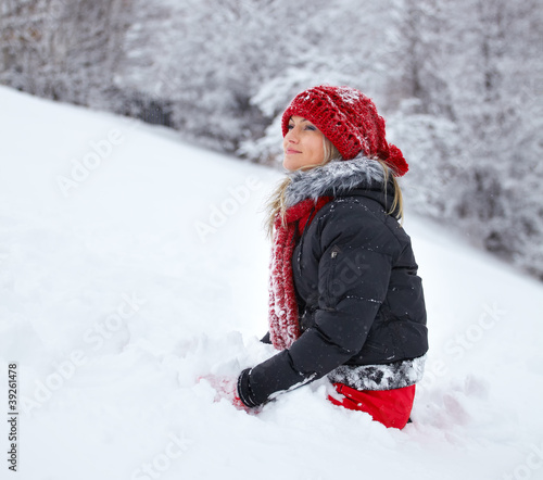 Young woman having fun in the snow