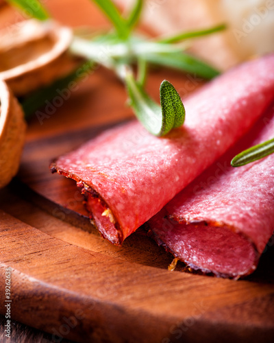 Closeup of Spicy Salami with fresh Rosemary