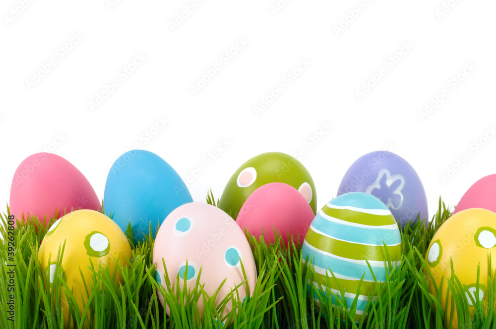 Easter colored eggs on the grass.